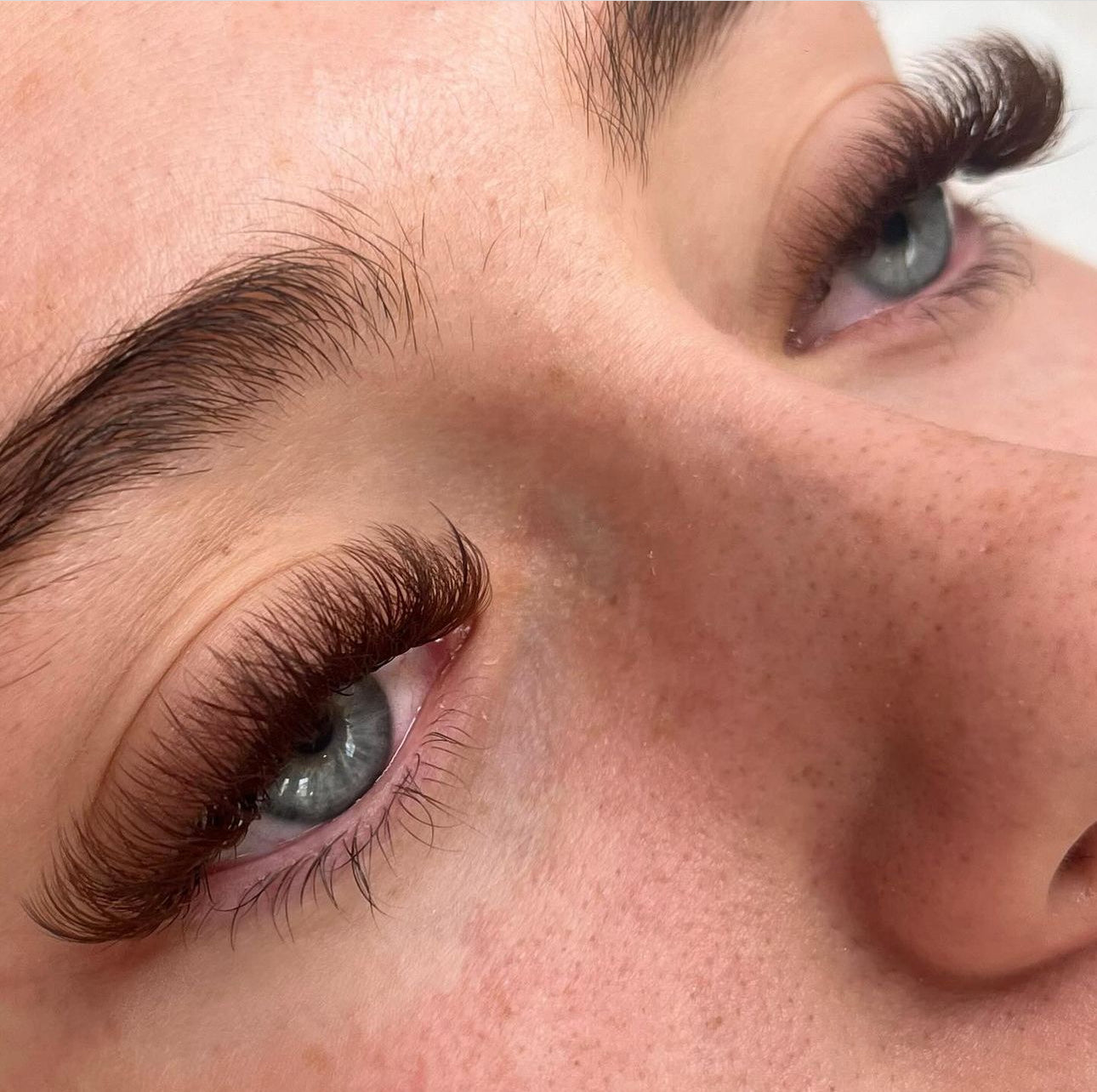 Showcase of long, thick, beautifully curled eyelashes enhanced by Belo Lash products, highlighting their dramatic elegance.