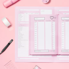 Stylish BELO-branded diary placed on a pink surface, includes a journal alongside essential Belo Lash care products for comprehensive eyelash care routines.