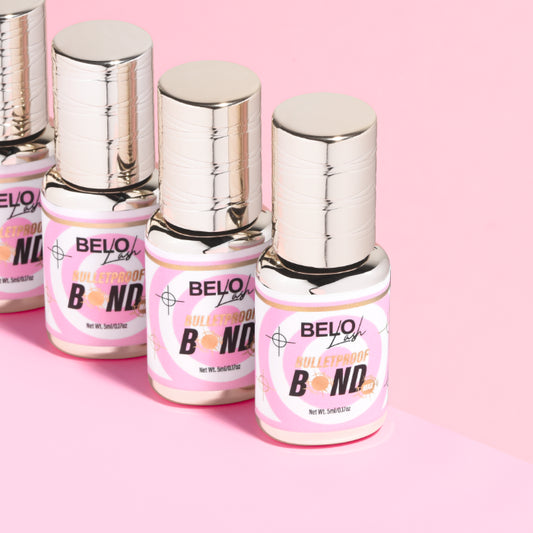 Belo Lash Bulletproof Bond bottles in row on pink background