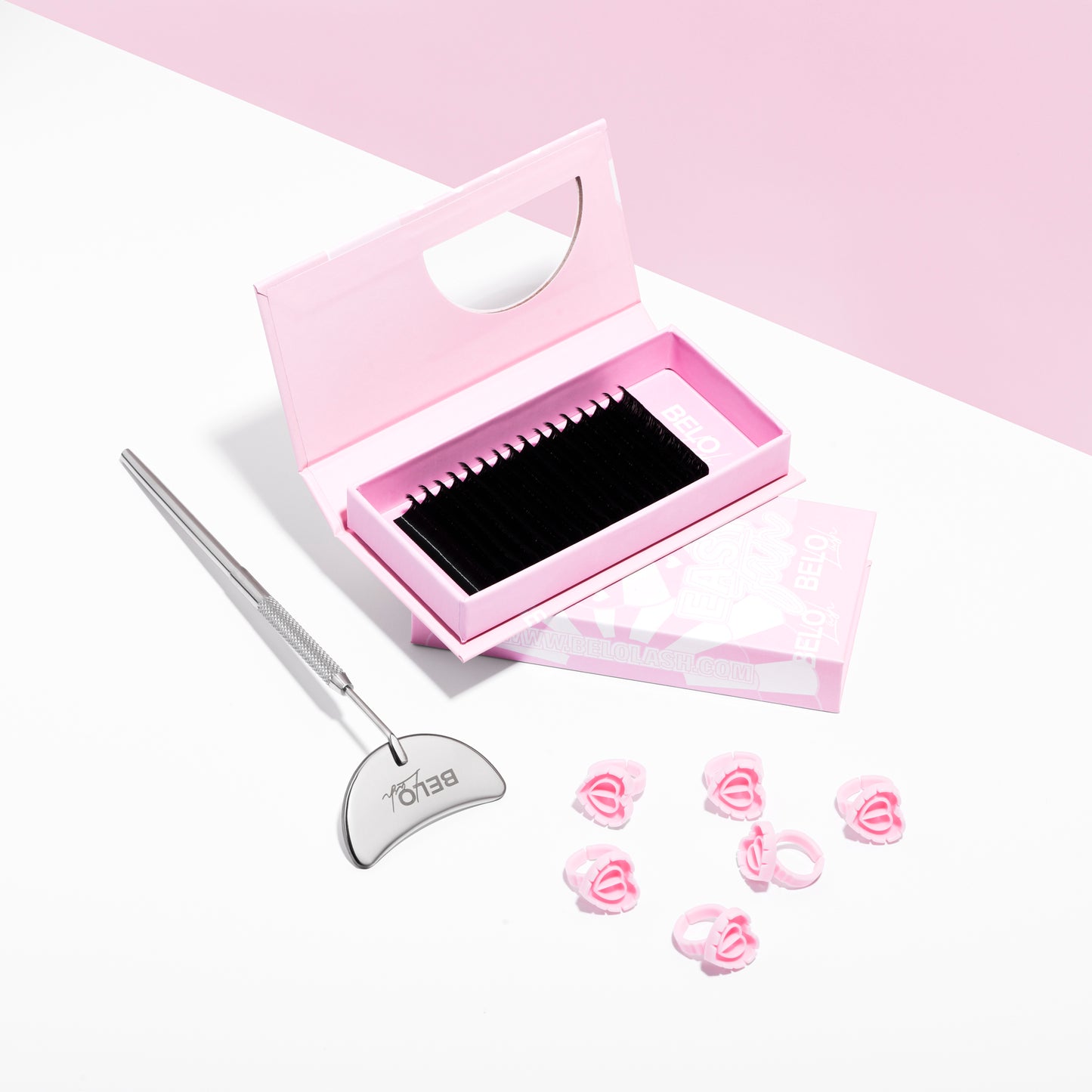 Lash trays and heart glue rings for organized and efficient lash application, streamlining the eyelash extension process.